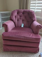 Front view showing tufted back, seat cushion, arms, color