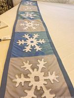 Table runner laid out showing snowflake panels