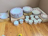 Full set showing plates, bowls, cups, sugar, creamer