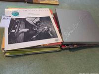 Stack of LPs with Living Chicago Blues on top next to Elvis Presley box set