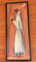 Vertical painting depicting robed figure holding birds, signed lower right