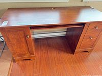 Front view of full wooden desk showing overall design