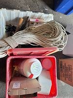 overview of totes with rope, tools, bucket, pots