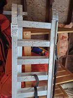 Full view of first aluminum loading ramp showing overall construction and rung spacing