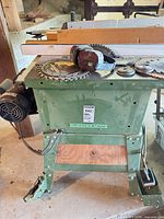 Full view of table saw with accessories on cast iron top