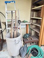 Overall lot with ladder, shovels, hoses, bin, watering can