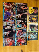 All 14 basketball cards laid out face-up on table