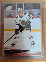 Front of Connor Bedard Upper Deck base card in top loader