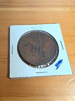 Reverse of Canadian bronze cent in 2x2 flip