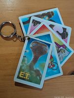 Front view showing several laminated E.T. image tags on metal ring