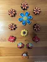 All 12 shoe charms laid out on table