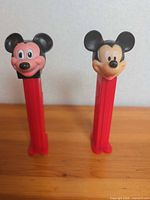 Front view of both Mickey Mouse PEZ dispensers