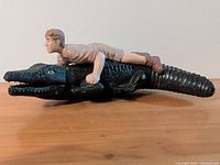 Left side view of wind-up Crocodile Hunter toy