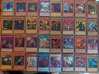 All 32 Yu-Gi-Oh! cards laid out in four rows