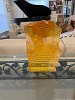 Front view showing internal staircase motif and overall form