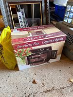 Front view of retail box showing jewellery box image and product name