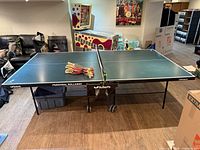 Butterfly Personal Rollaway table fully assembled with paddles centered