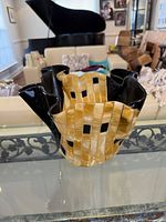 Front view showing ruffled rim, color scheme and form