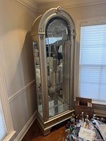 Full view of platinum-finish Howard Miller Coastal Point grandfather clock in corner