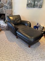 Front-left view of black leather Italsofa chaise lounge