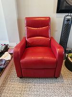 Front view of red leather recliner chair upright