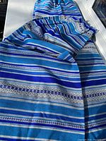 Full view of one panel showing stripe pattern and pleated top