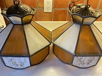 Both octagonal stained glass lights side by side showing overall design, colors, and metal caps