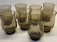 front view of eight smoky brown tulip tumblers