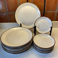Stacked dinner and dessert plates showing quantity and design