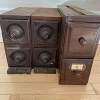 Front view of all three drawer units showing drawer fronts, knobs and general wear