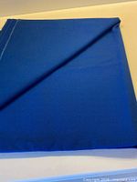 Folded bolt showing full piece of royal blue fabric