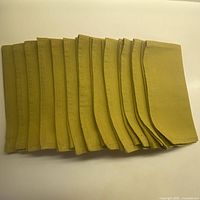 Stack of all 12 folded napkins