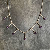 Full view of necklace showing overall design and all five amethyst drops