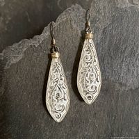 Full view of both sterling silver and etched glass earrings