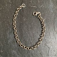 Full view of sterling silver cable link bracelet laid flat