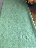 Tablecloth laid flat showing textured weave and color