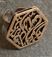 Top view showing hexagonal filigree face