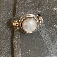 Front view of sterling silver ring with moonstone cabochon