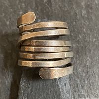 Front view showing spiral wrap design and tarnished sterling surface