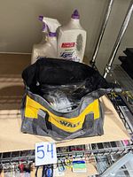 items inside bag on shelf with cleaners