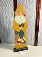 Full view of standing wooden decoration