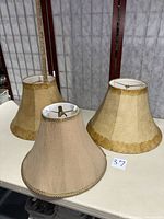 Front view showing all three lamp shades on table