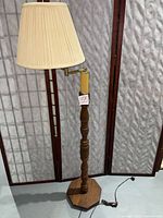 Full view of floor lamp with shade and base