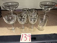 All eight glasses grouped on shelf