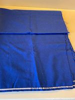 Full view of folded royal blue wool flannel fabric