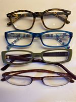 all four pairs of reading glasses aligned for overview