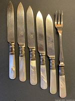 Full view of five knives and one fork showing design and condition