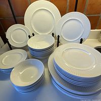 overview of stacked plates and bowls showing counts and condition