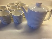 group view teapot with all 8 mugs