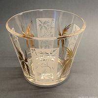 full view of tapered clear glass ice bucket with palm tree design